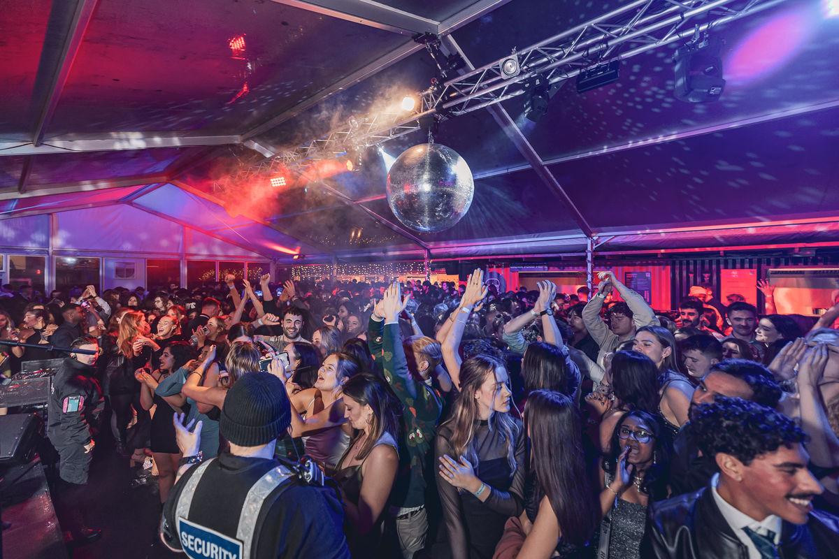 Guests dancing in a heated marquee at Christmas